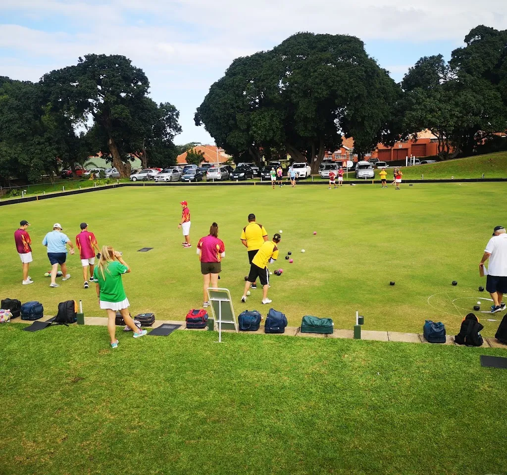 Members playing bowls on the green